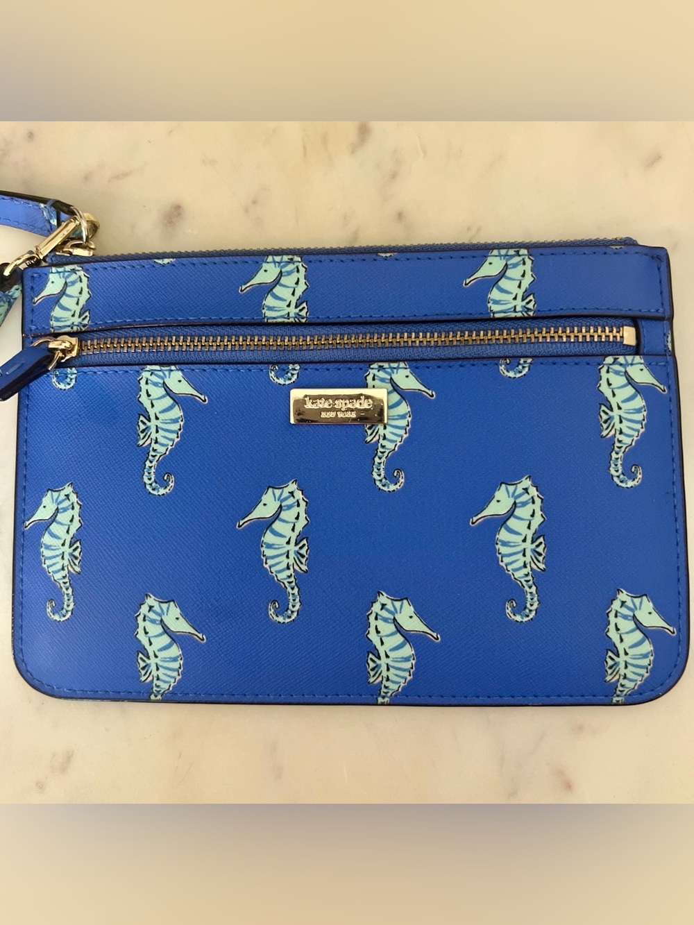 kate spade cobalt blue seahorse wristlet clutch